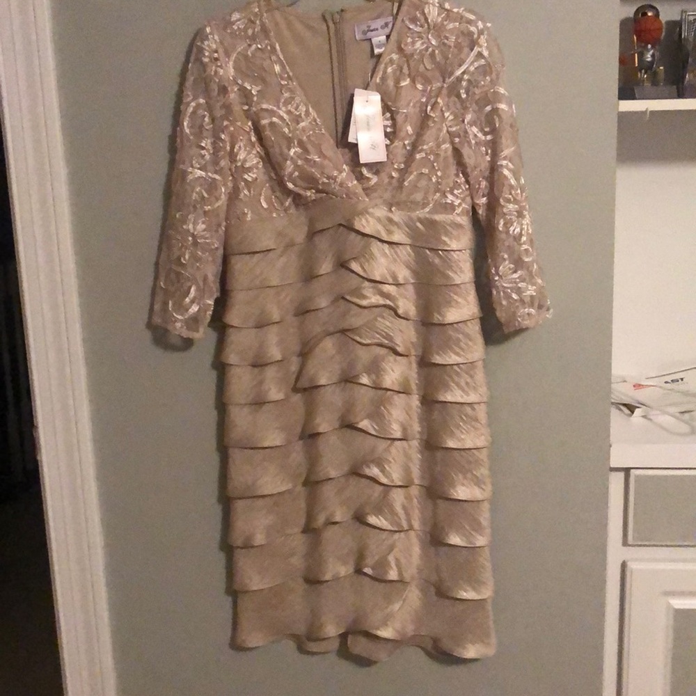 Gold scalloped, layered dress.